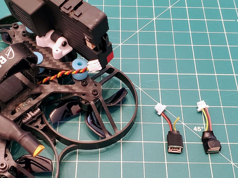 Use the Insta360 SMO adapter for quads that have a naked GoPro power cable